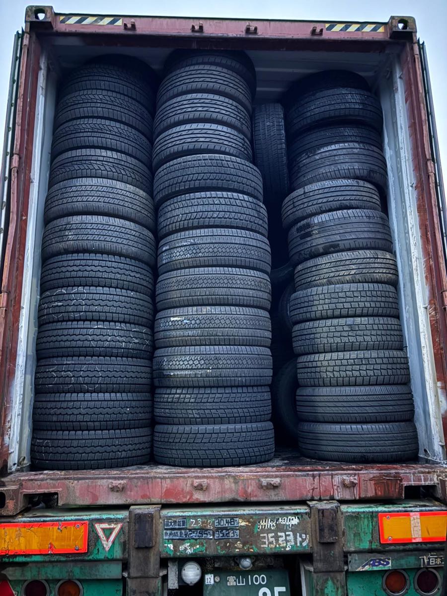 Completed container loading of client-selected tires for export from Japan